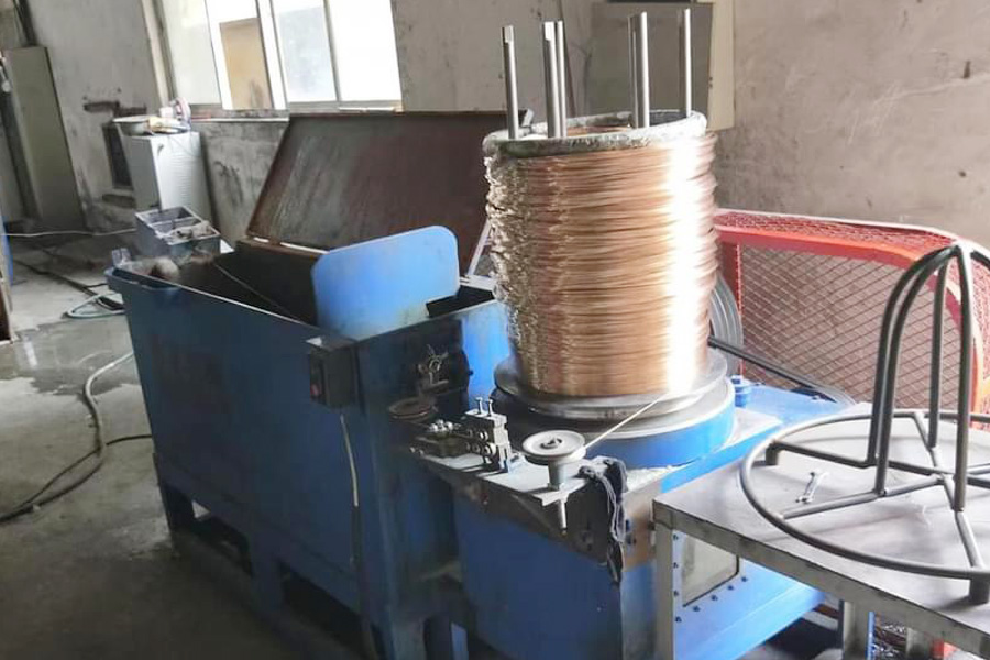 Industrial Winding Machine with a Large Copper Coil Ready for Insulation