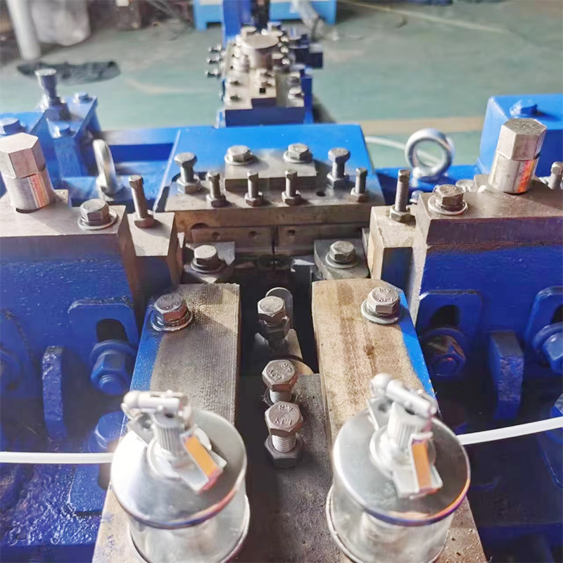 Close up of a Blue Industrial Stamping Press with Metal Dies Bolts and Clamps in a Factory Setting