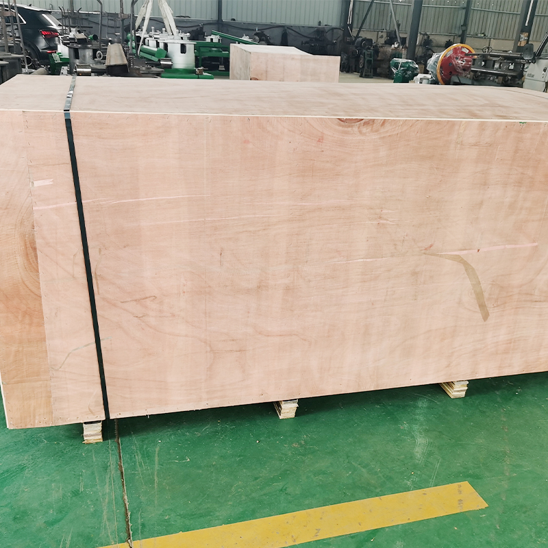 nail making machine package - YF Metal Tech Large Wooden Crate on a Pallet in a Warehouse Secured with a Black Strap Workshop Equipment and Machinery Visible in the Background