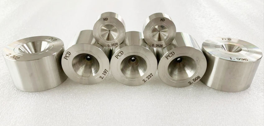 PCD die for copper wire drawing - YF Metal Tech Row of Stainless Steel Spacersbushings with Engraved Labels pcd Nd and Numbers Arranged on a White Surface